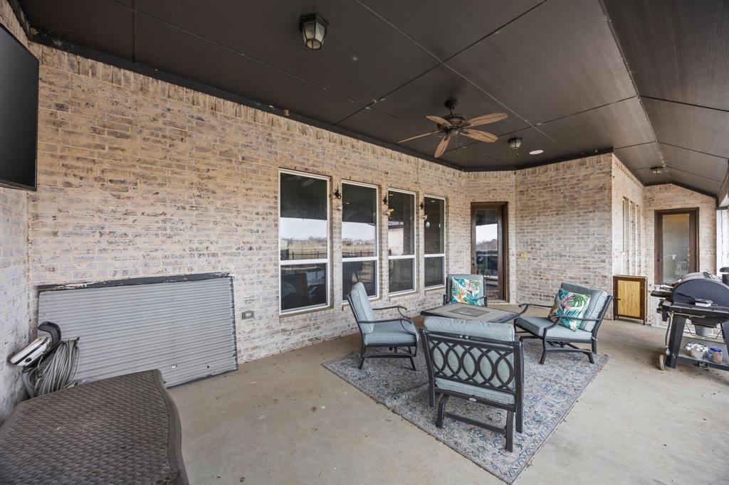13688 Jackson Road Ponder, TX 76259 - Photo 17 of 20 a balcony with furniture and a fireplace