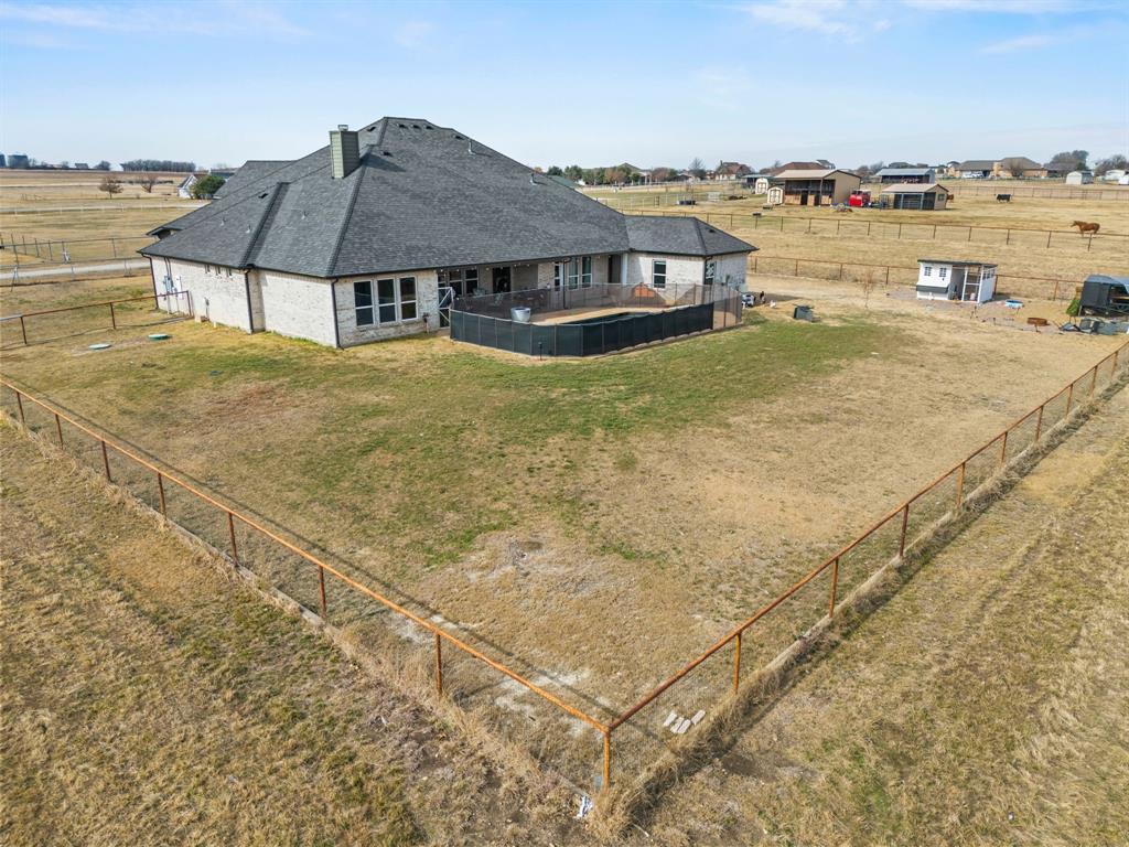 13688 Jackson Road Ponder, TX 76259 - Photo 20 of 20 a view of a patio with a table and chairs under an umbrella
