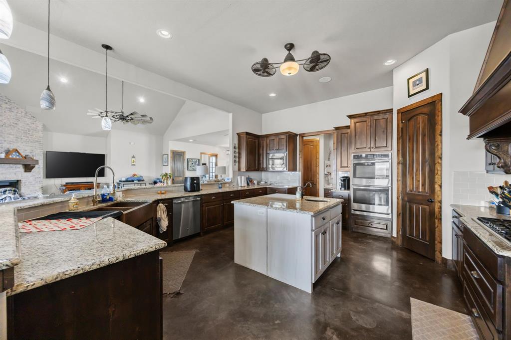 13688 Jackson Road Ponder, TX 76259 - Photo 7 of 20 a kitchen with cabinets and stainless steel appliances