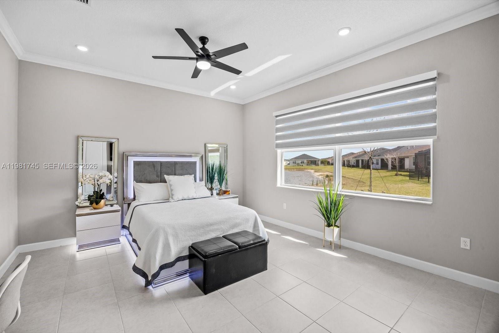 1204 Southeast Woodbine Road Port St. Lucie, FL 34984 - Photo 20 of 46 a bedroom with a bed and window