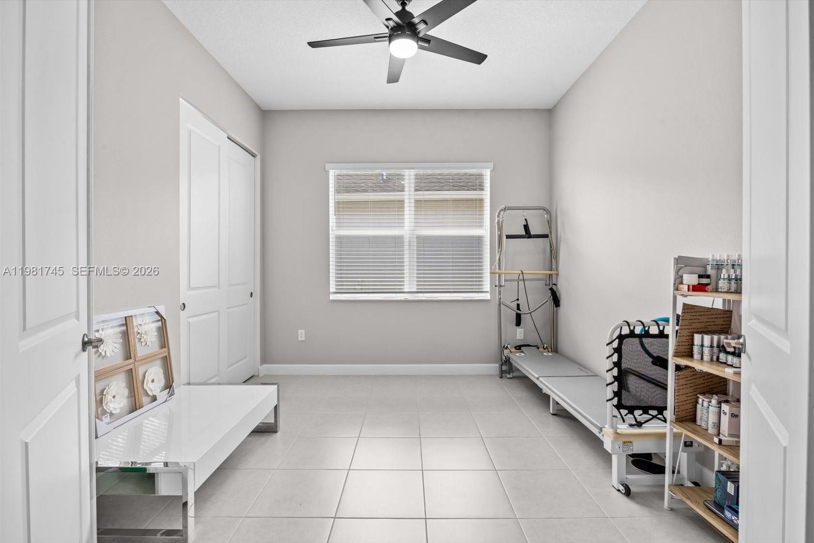 1204 Southeast Woodbine Road Port St. Lucie, FL 34984 - Photo 35 of 46 a living room with furniture and a window