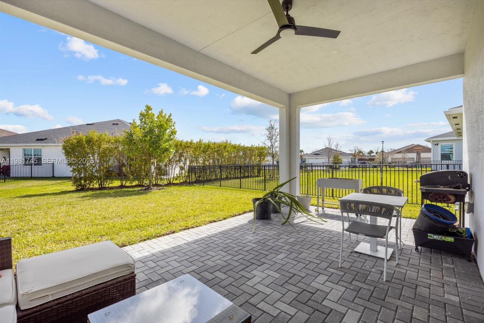1204 Southeast Woodbine Road Port St. Lucie, FL 34984 - Photo 40 of 46 a view of swimming pool with outdoor seating