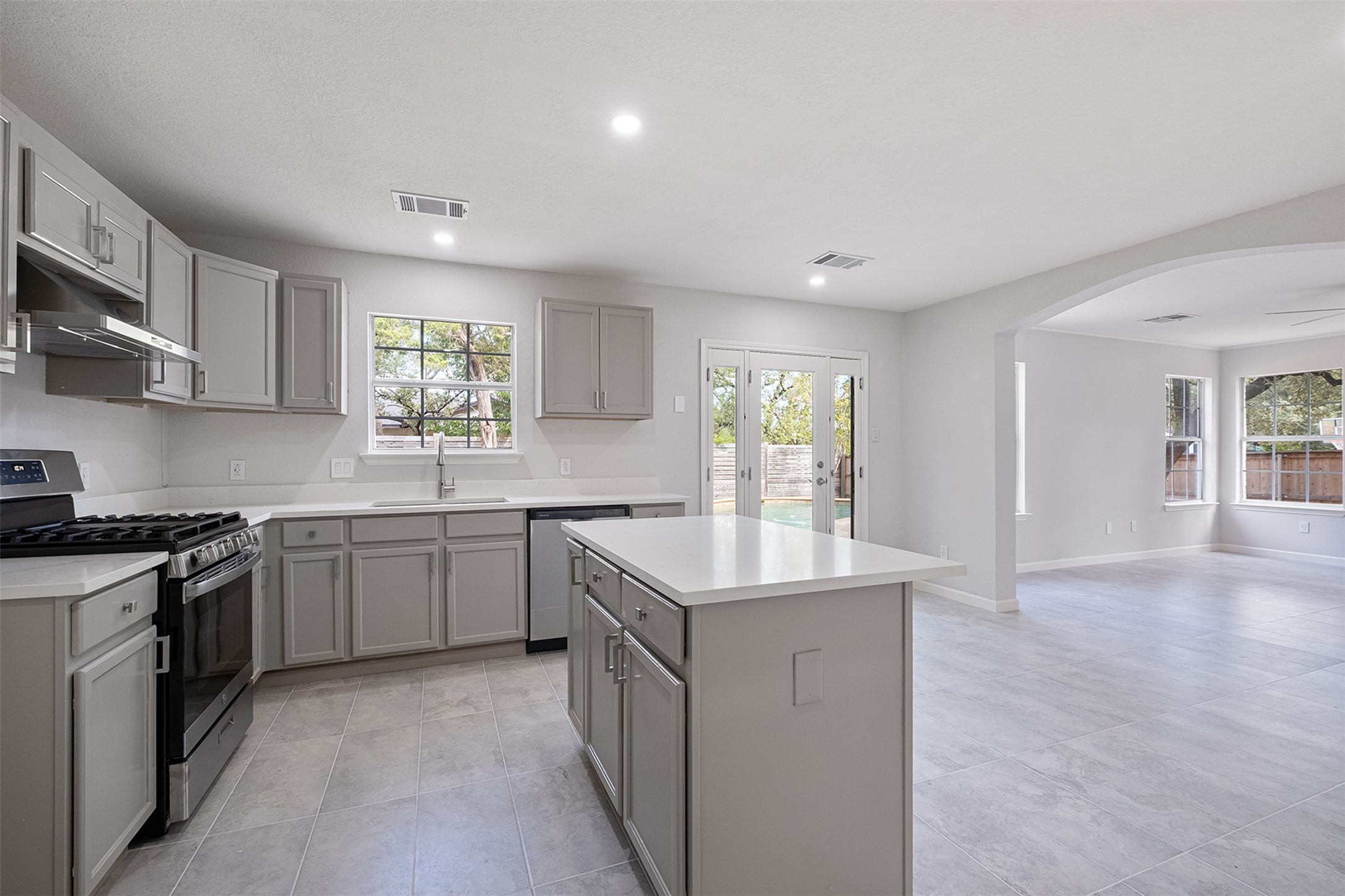 2101 Bridal Path Cedar Park, TX 78613 - Photo 13 of 38 a kitchen with stainless steel appliances granite countertop a sink stove and cabinets