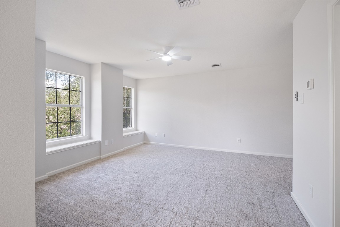2101 Bridal Path Cedar Park, TX 78613 - Photo 19 of 38 an empty room with windows and closet