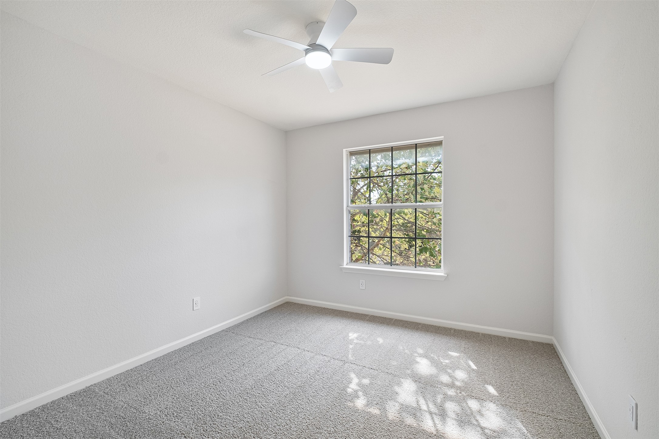 2101 Bridal Path Cedar Park, TX 78613 - Photo 22 of 38 an empty room with a window and a fan