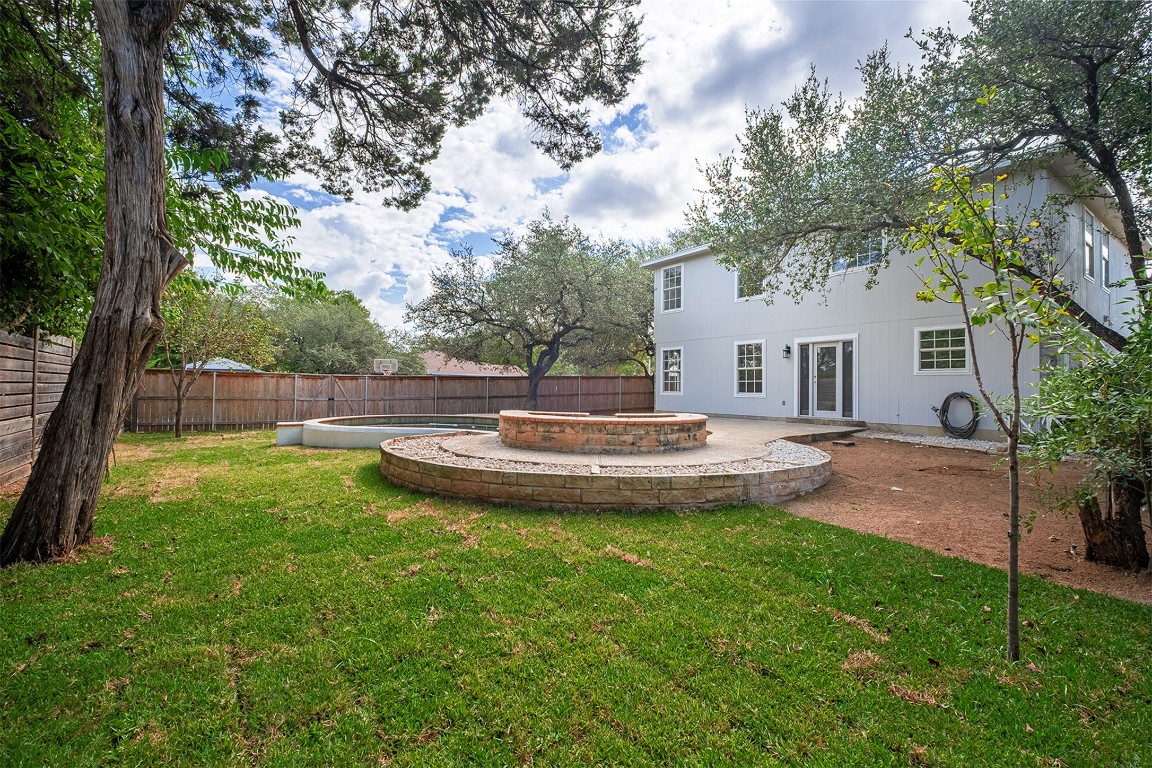 2101 Bridal Path Cedar Park, TX 78613 - Photo 34 of 38 a view of a house with a backyard and a tree