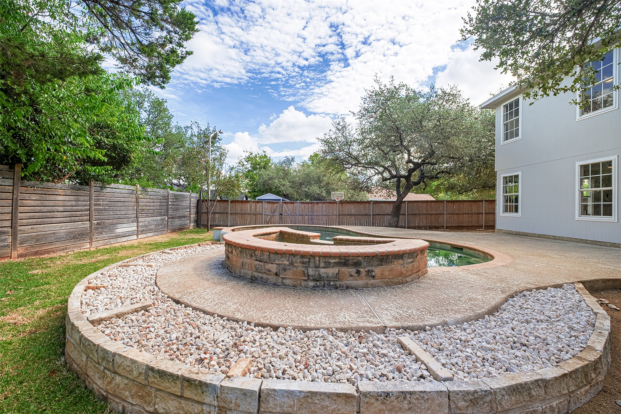 2101 Bridal Path Cedar Park, TX 78613 - Photo 35 of 38 a view of a swimming pool with a garden
