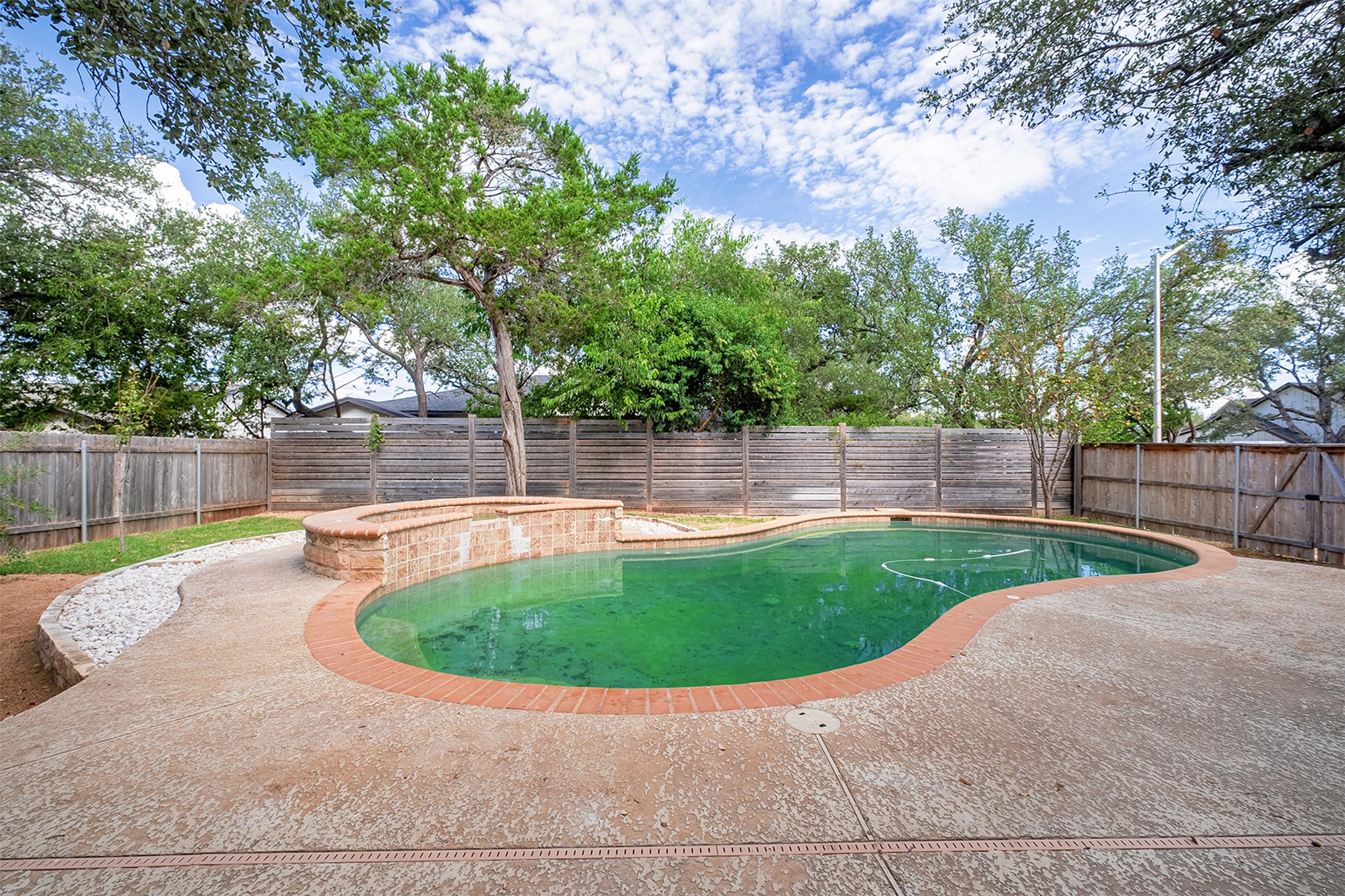 2101 Bridal Path Cedar Park, TX 78613 - Photo 37 of 38 a view of a swimming pool with a patio