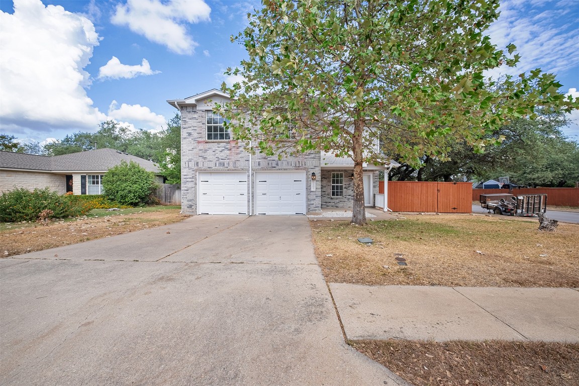 2101 Bridal Path Cedar Park, TX 78613 - Photo 4 of 38 front view of a house with a yard and a garage