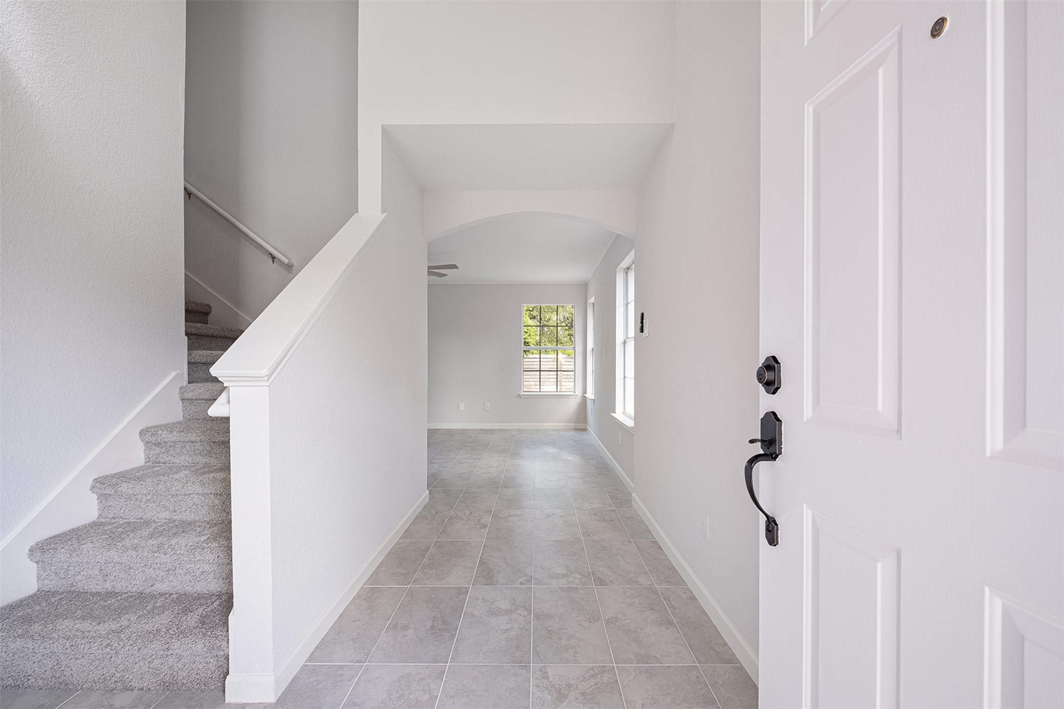 2101 Bridal Path Cedar Park, TX 78613 - Photo 5 of 38 a view of a hallway with white walls and stairs