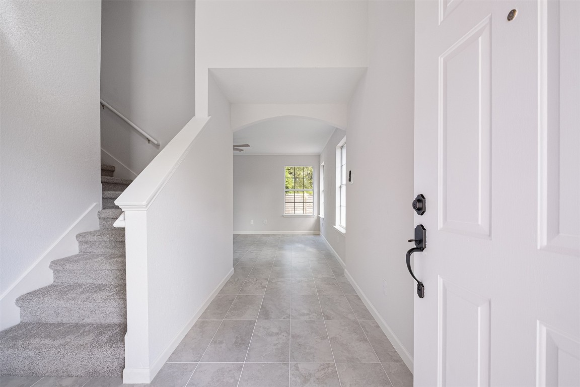 2101 Bridal Path Cedar Park, TX 78613 - Photo 5 of 38 a view of a hallway with white walls and stairs