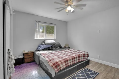 a bedroom with a bed and window