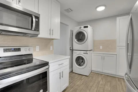 a kitchen with a stove and a microwave