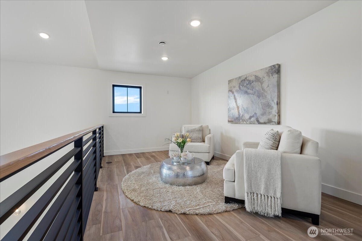 211 Pebblebrook Drive Lynden, WA 98264 - Photo 11 of 36 a living room with furniture and wooden floor
