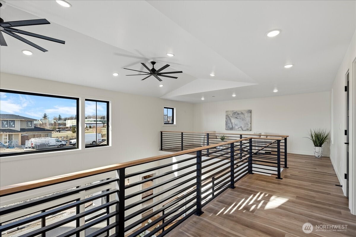 211 Pebblebrook Drive Lynden, WA 98264 - Photo 12 of 36 a view of a room with wooden floor and windows