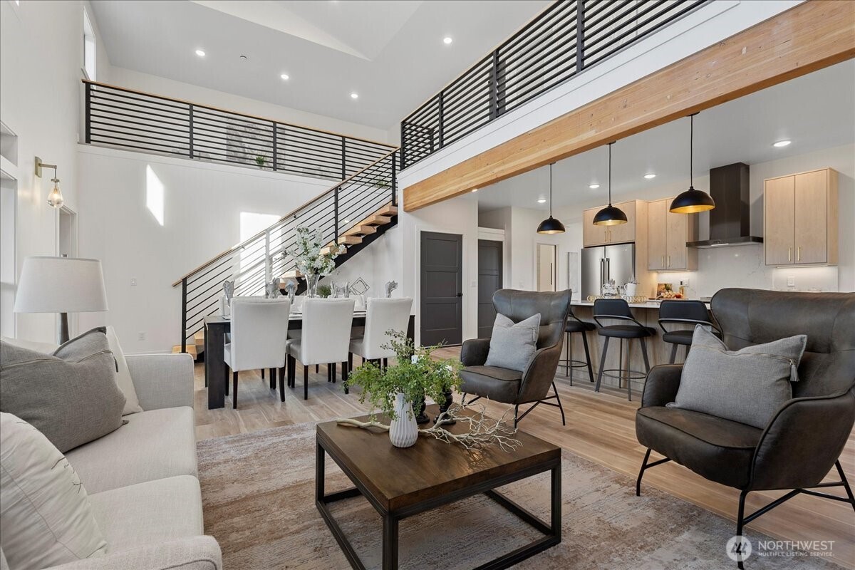 211 Pebblebrook Drive Lynden, WA 98264 - Photo 23 of 36 a living room with furniture kitchen view and a dining table