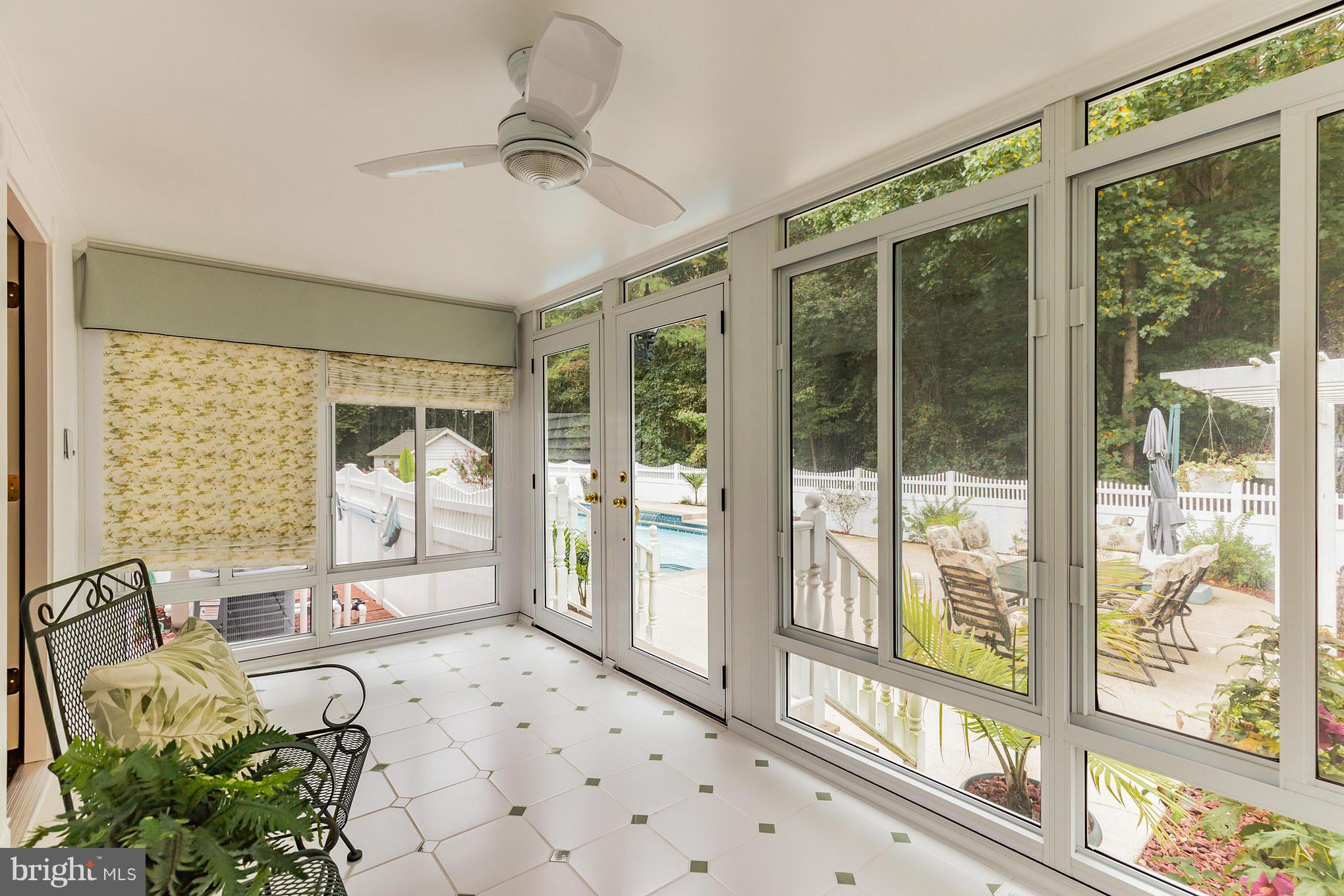 1808 Hatfield Road Huntingtown, MD 20639 - Photo 16 of 30 Sun Room Leading to In-Ground Pool