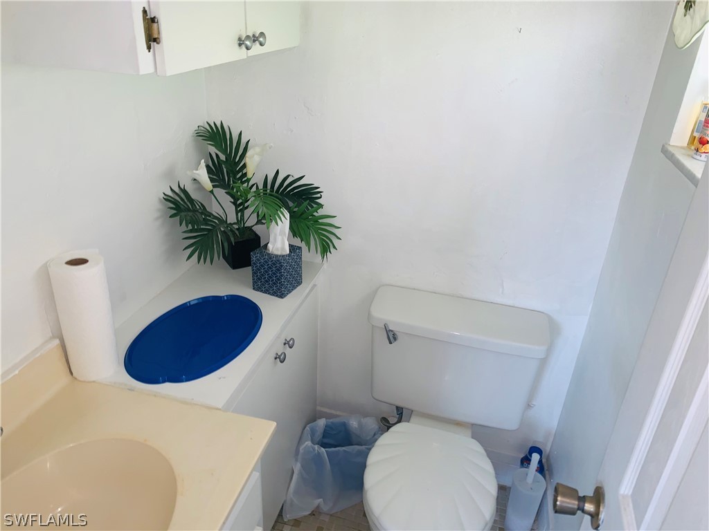 18189 Iris Road Fort Myers, FL 33967 - Photo 11 of 30 a bathroom with a toilet and a sink