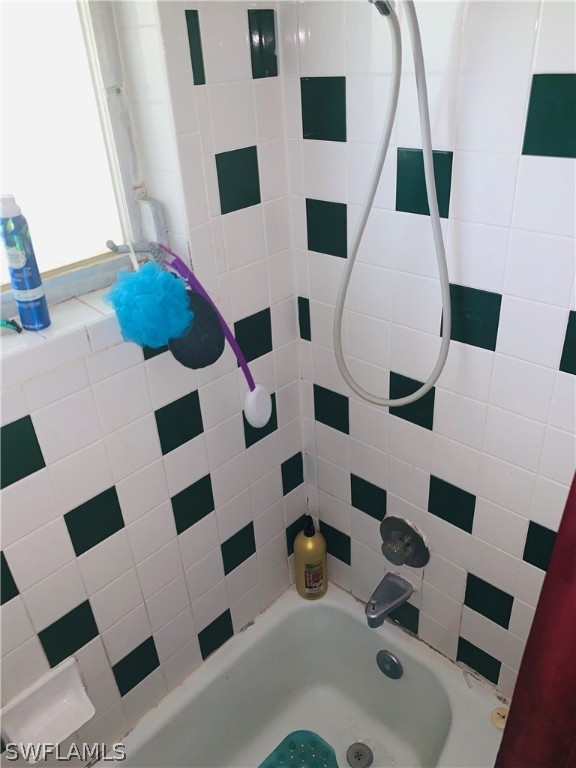 18189 Iris Road Fort Myers, FL 33967 - Photo 15 of 30 a bathroom with a sink and a mirror