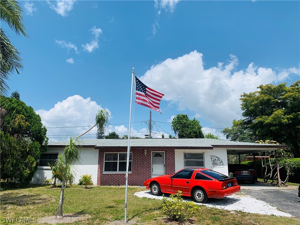 18189 Iris Road Fort Myers, FL 33967 - Photo 30 of 30 a view of a house with a cars park