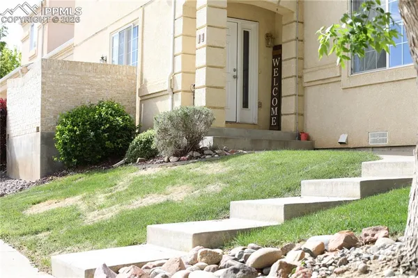 a view of backyard with outdoor seating