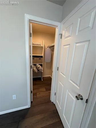 a view of a room with furniture and table