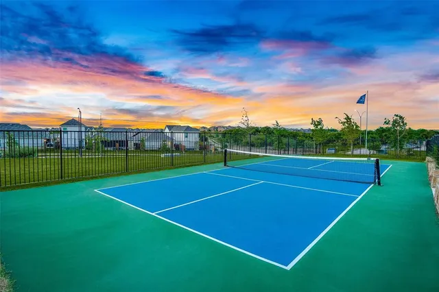 a view of an outdoor space and tennis court