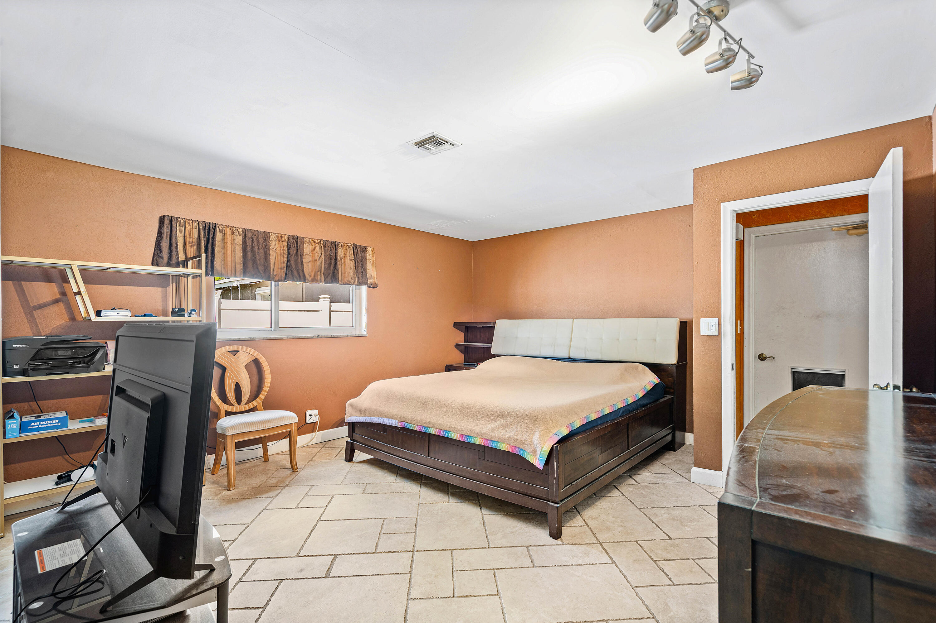 5811 Southwest 53rd Terrace Davie, FL 33314 - Photo 12 of 31 a bedroom with a bed and dresser