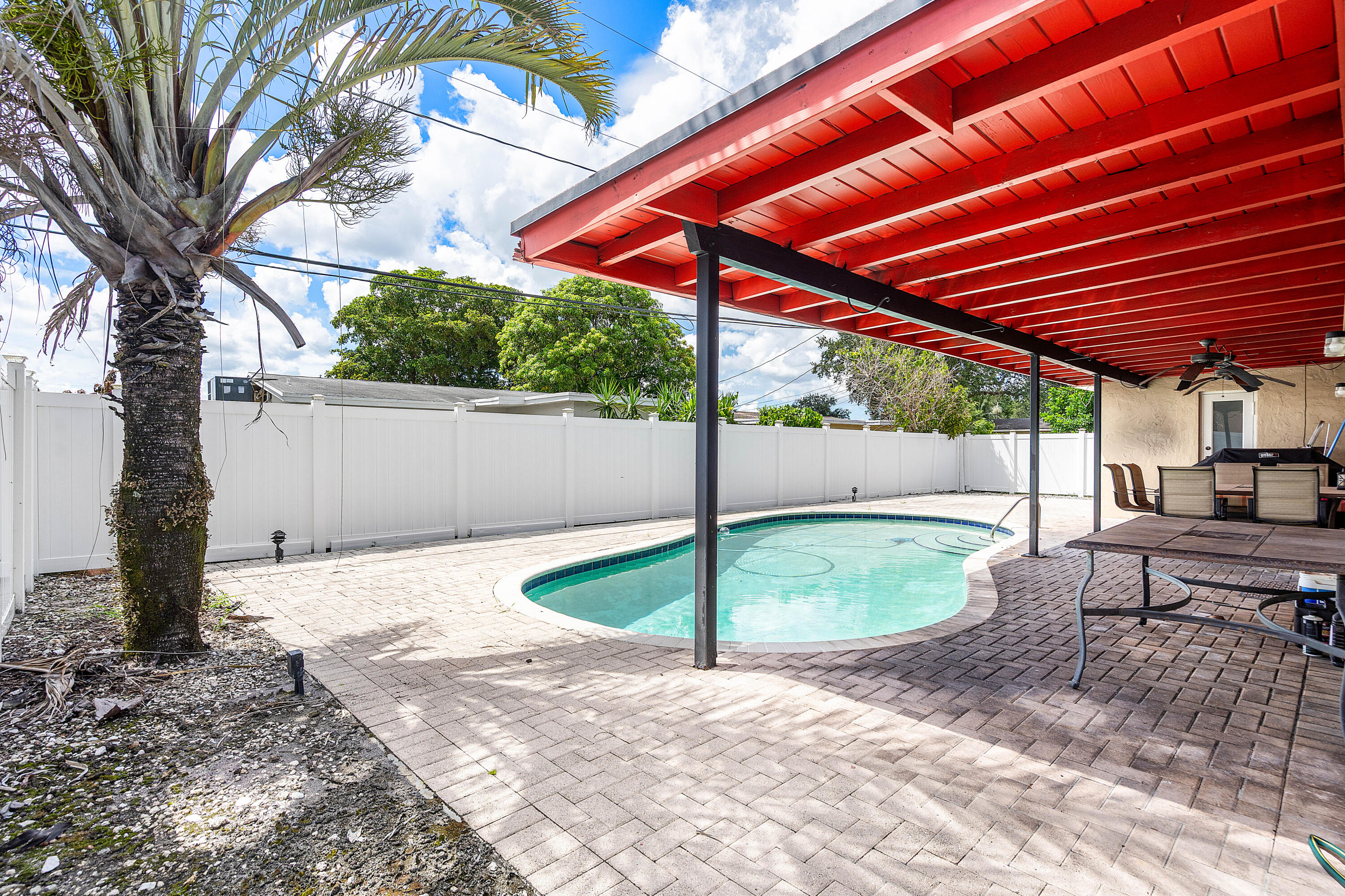 5811 Southwest 53rd Terrace Davie, FL 33314 - Photo 19 of 31 a backyard of a house with a garden
