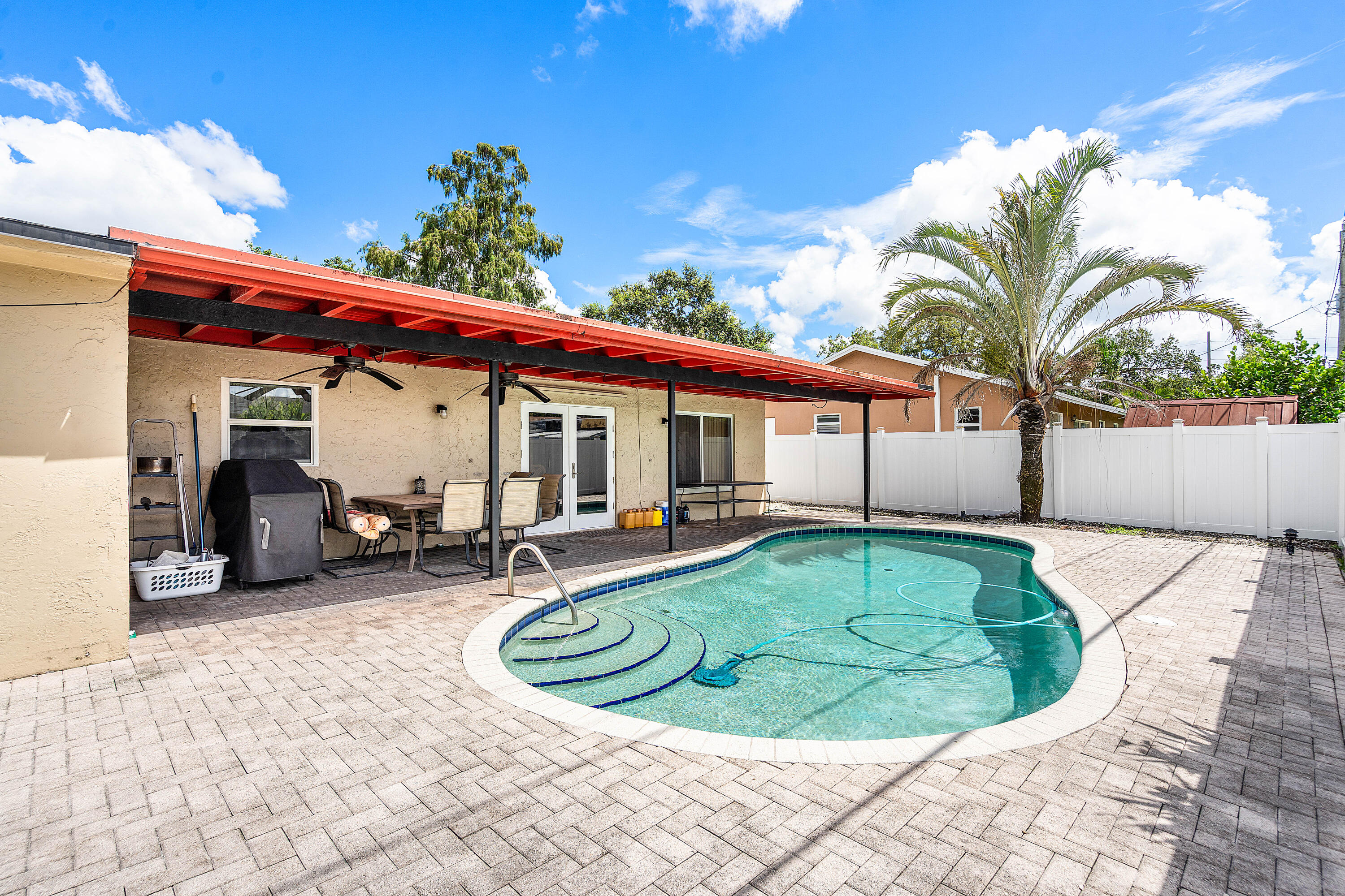 5811 Southwest 53rd Terrace Davie, FL 33314 - Photo 21 of 31 a view of a white house with swimming pool