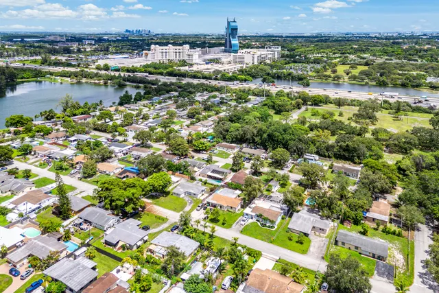 an aerial view of residential houses with outdoor space