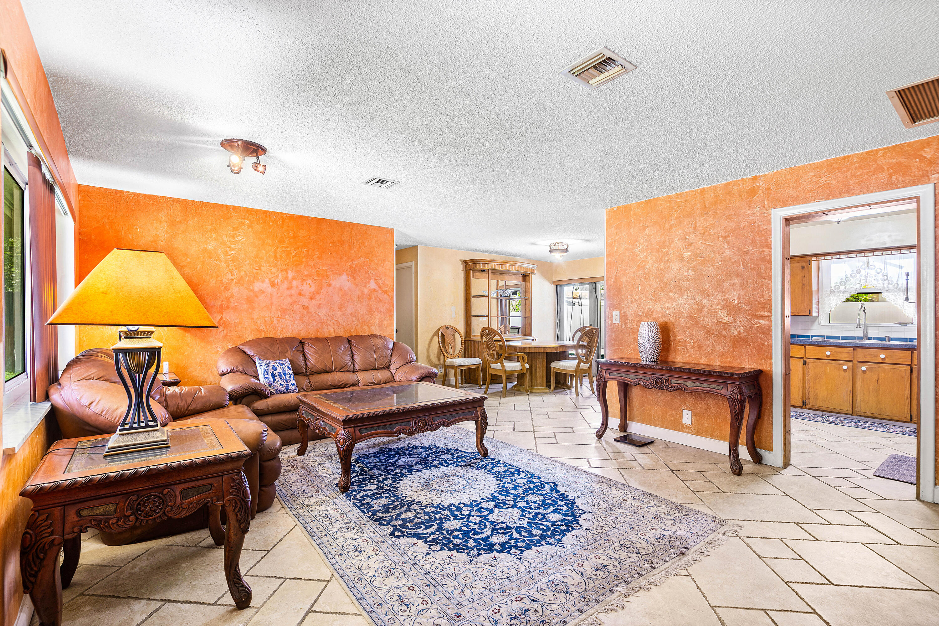 5811 Southwest 53rd Terrace Davie, FL 33314 - Photo 6 of 31 a living room with patio furniture and a rug