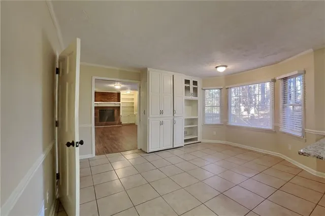 a view of an empty room and window