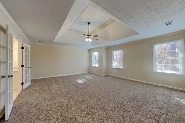 a view of an empty room with a window