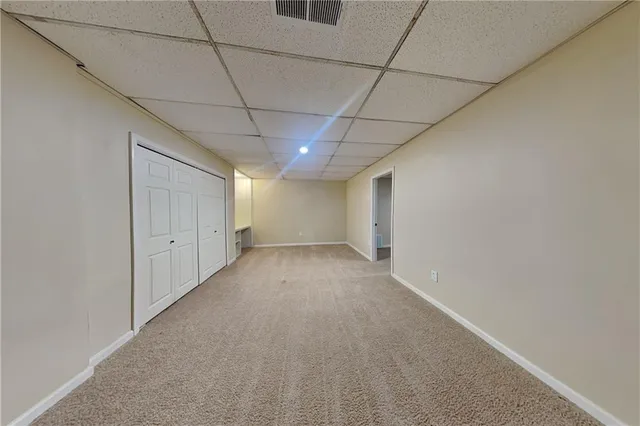 a view of hallway with a ceiling fan