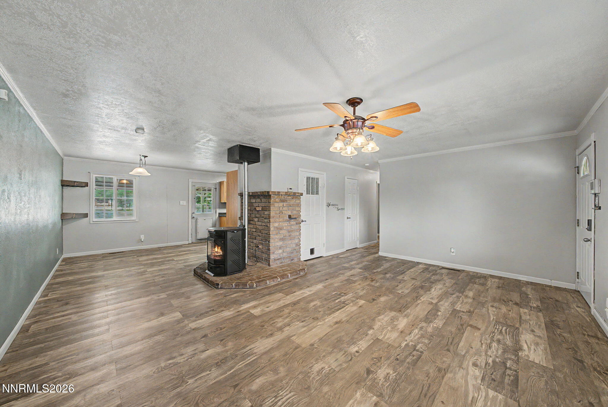 11577 Deodar Way Reno, NV 89506 - Photo 12 of 58 a view of empty room with wooden floor and ceiling fan