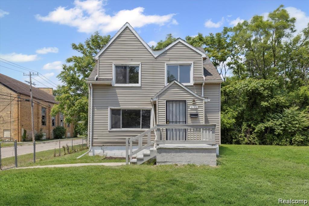 3140 Moore Street Inkster, MI 48141 - Photo 1 of 18 Two-story residential structure featuring light-colored siding and a twin gabled roofline
