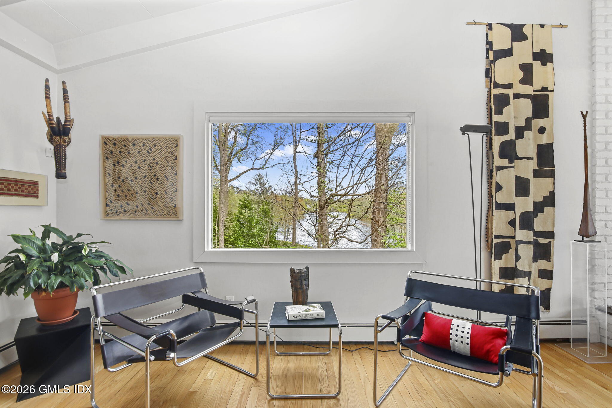 185 Valley Road Cos Cob, CT 06807 - Photo 10 of 38 a living room with furniture and a potted plant