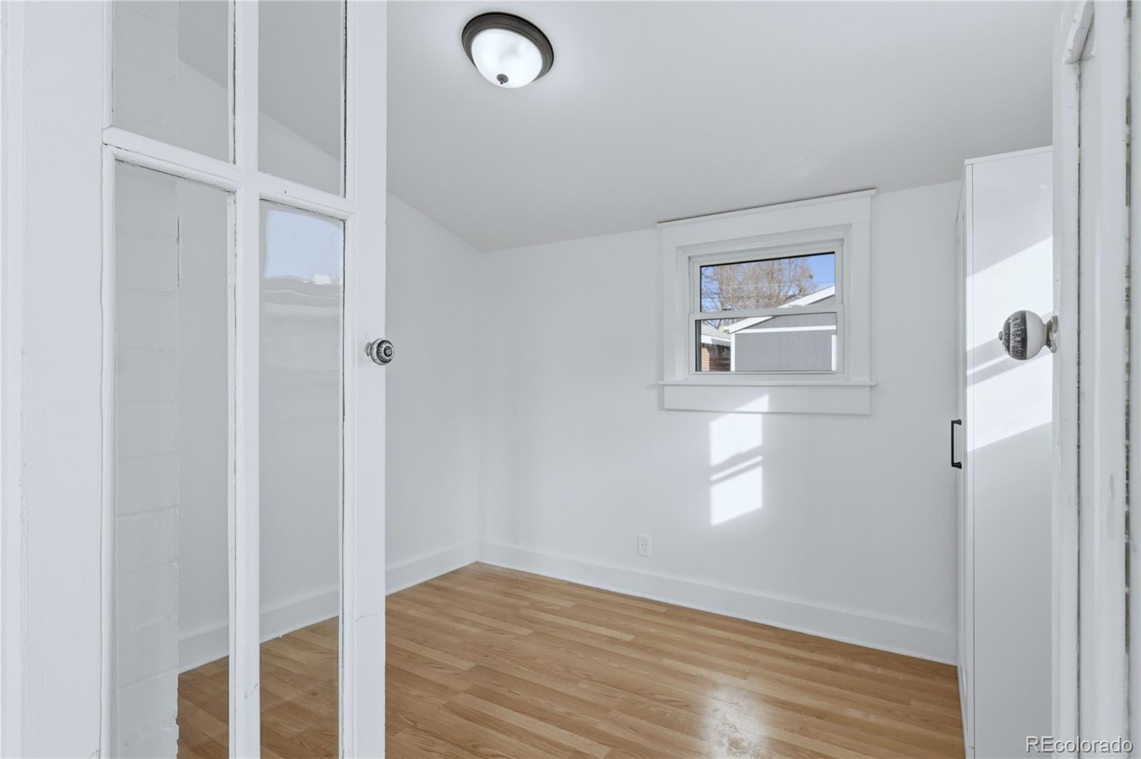 3051 West 37th Avenue Denver, CO 80211 - Photo 20 of 37 a view of empty room with wooden floor