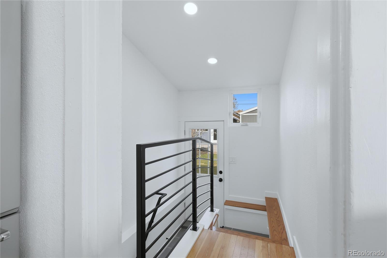 3051 West 37th Avenue Denver, CO 80211 - Photo 23 of 37 a view of a hallway with stairs