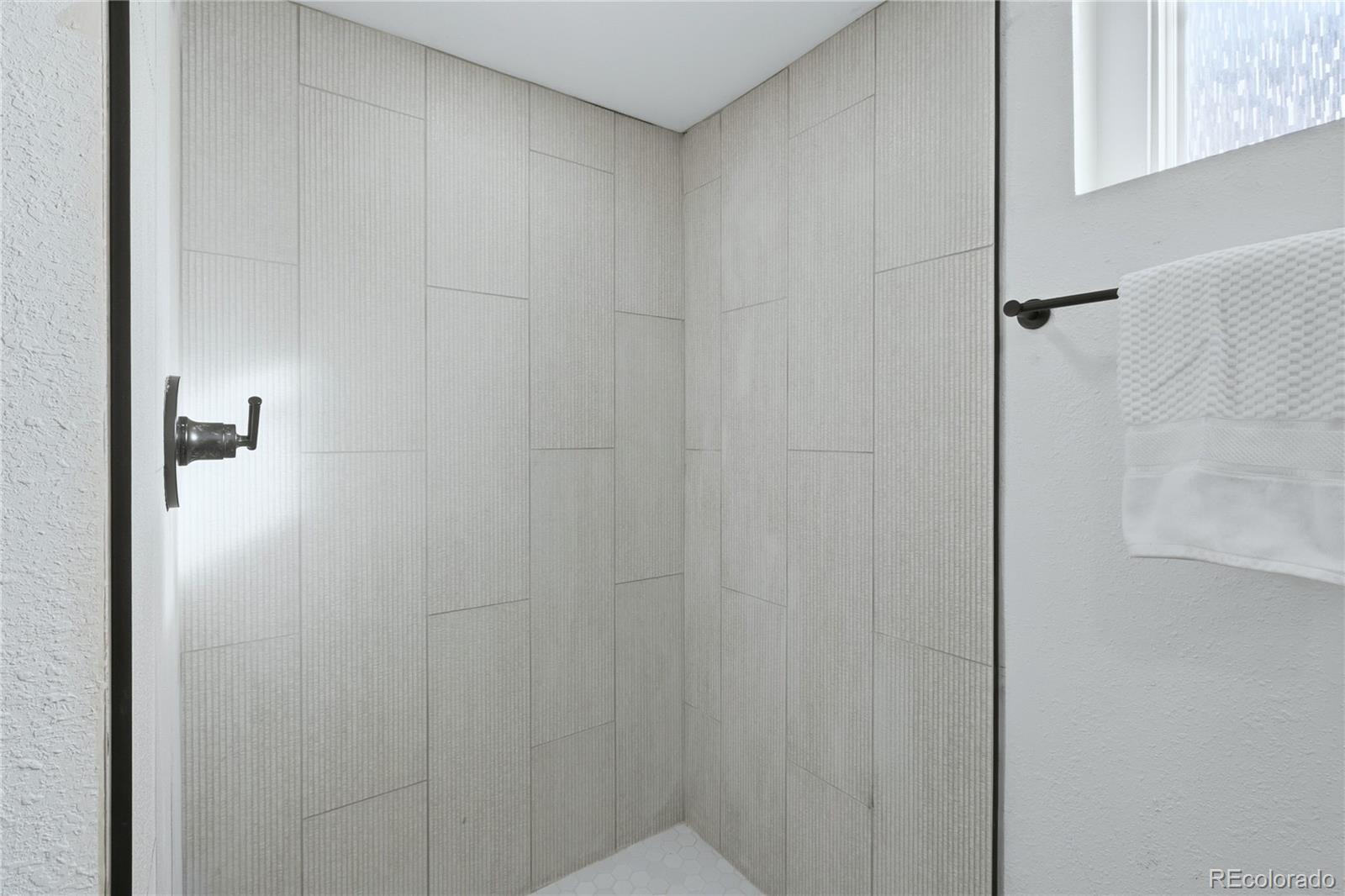 3051 West 37th Avenue Denver, CO 80211 - Photo 28 of 37 a bathroom with a shower