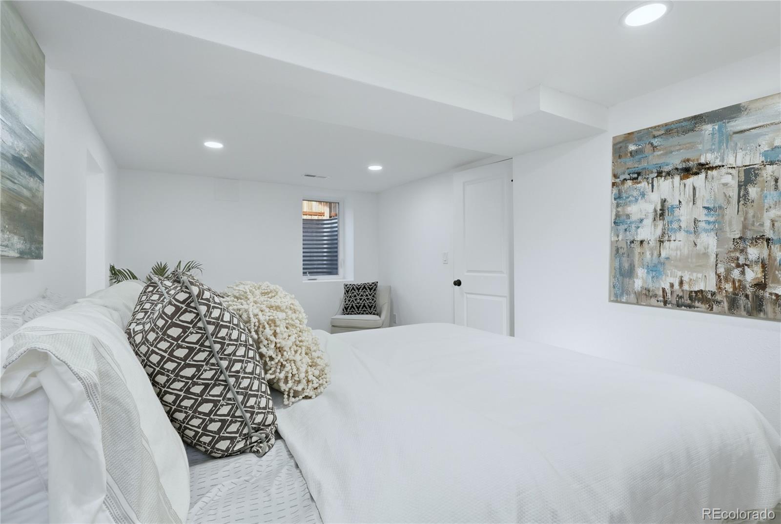 3051 West 37th Avenue Denver, CO 80211 - Photo 30 of 37 a large bedroom with bed and a window