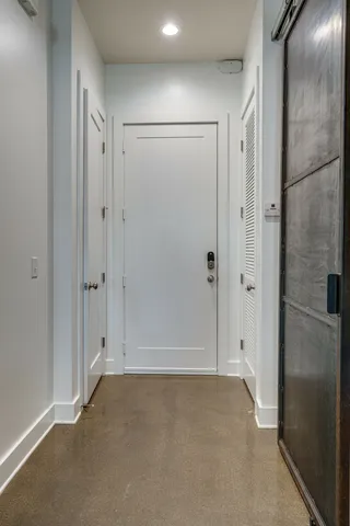 a living room with table and chairs