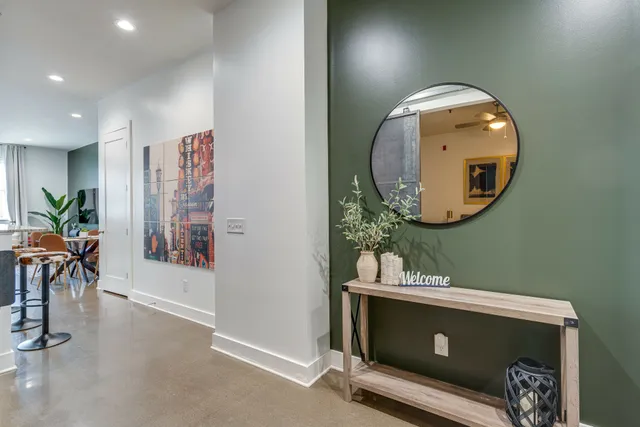 a bedroom with a table and chair