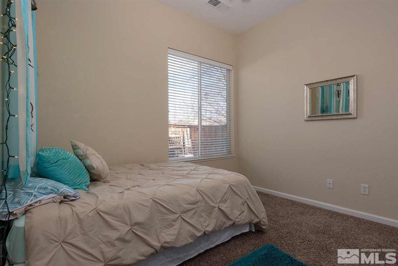 1325 South Fox Glen Court Reno, NV 89521 - Photo 15 of 25 a bedroom with a bed and a window