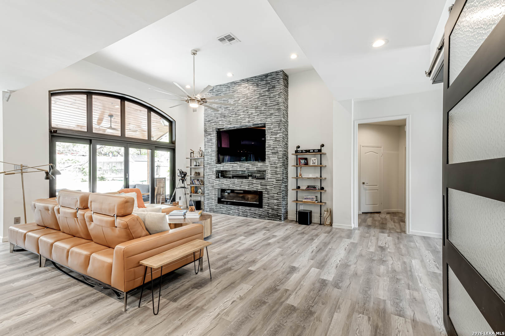 15919 Mission Ridge San Antonio, TX 78232 - Photo 12 of 43 a living room with fireplace furniture and a flat screen tv