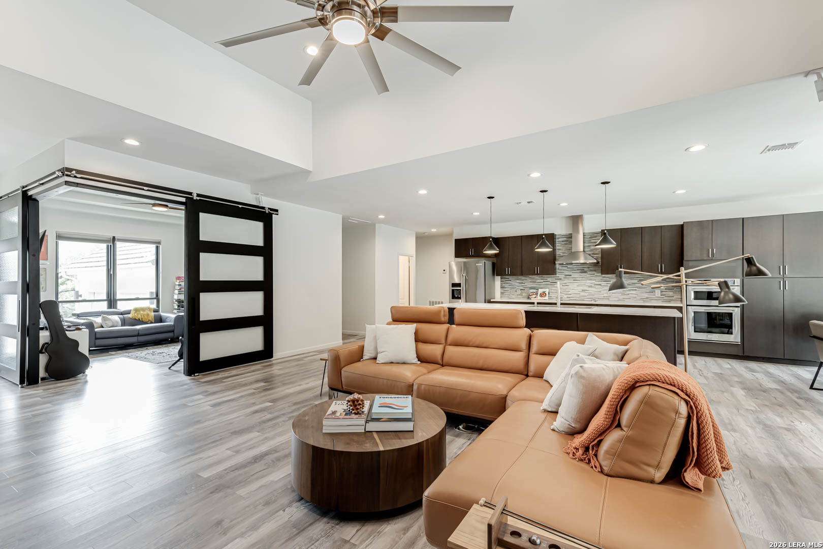 15919 Mission Ridge San Antonio, TX 78232 - Photo 15 of 43 a living room with furniture kitchen view and a wooden floor