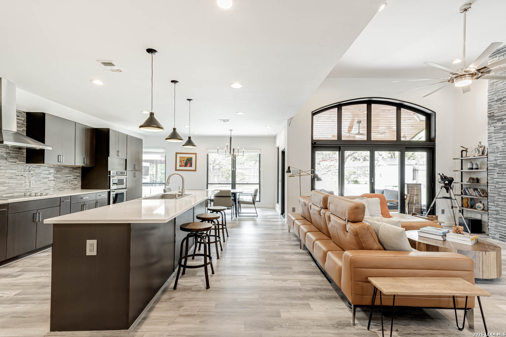 15919 Mission Ridge San Antonio, TX 78232 - Photo 17 of 43 a living room with furniture a flat screen tv and a large window