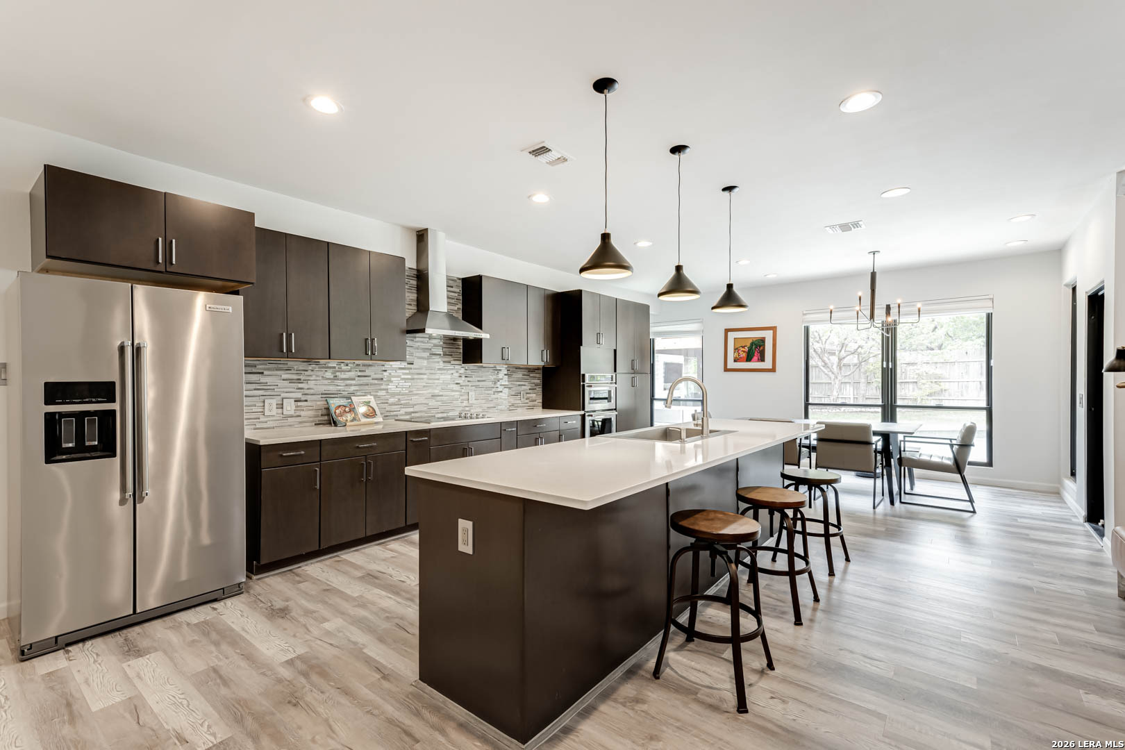 15919 Mission Ridge San Antonio, TX 78232 - Photo 18 of 43 a large kitchen with a table and chairs
