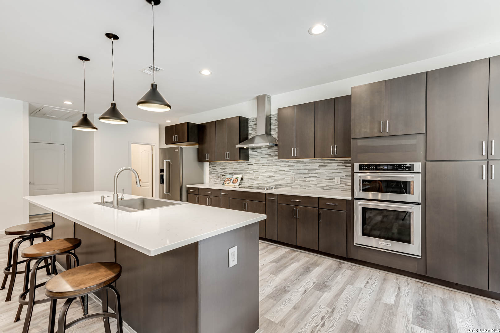 15919 Mission Ridge San Antonio, TX 78232 - Photo 19 of 43 a kitchen with kitchen island a sink stainless steel appliances and cabinets